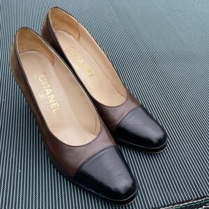 CHANEL Two-Tone Brown and Black Leather Cap-Toe Pumps